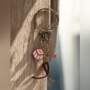 Clinique Silver and Pink Keychain Bag Charm